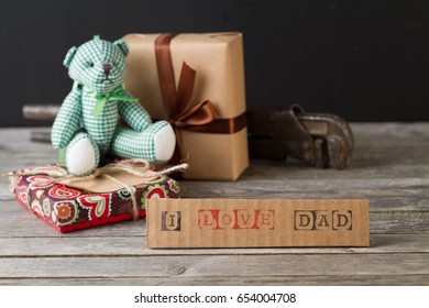 Getting Gifts Ready For Fathers Day And Work Tools On Wooden Background.