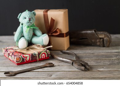 Getting Gifts Ready For Fathers Day And Work Tools On Wooden Background.