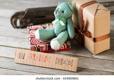 Getting Gifts Ready For Fathers Day And Work Tools On Wooden Background.