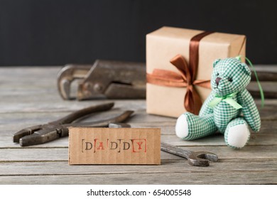 Getting Gifts Ready For Fathers Day And Work Tools On Wooden Background.