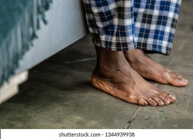 Getting Up In The Morning. Close Up Of Feet Touching The Floor While Getting Up From The Bed