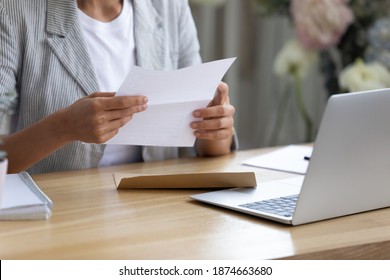 Getting News By Mail. Close Up Of Young Lady Involved In Paperwork At Home Office Studio Hold Paper Letter In Hands. Businesswoman Get Message Out Of Envelop Read Information From Bank Client Supplier