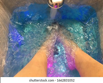 Getting a Pedicure Foot Bath in Calming Blue Water on Spa Day - Powered by Shutterstock