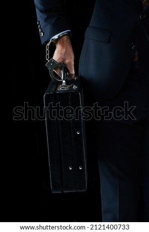 Getting the precious cargo there safely. Shot of an unrecognizable businessman with a briefcase handcuffed to his wrist.