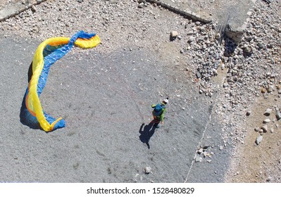 Getting Ready To Deploy Paragliding Parachute, From The Top Of German Mountain Zugspitze, 