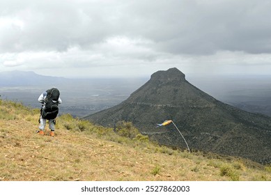 getting ready to fly of the top of the mountain  i think the wind is too strong 