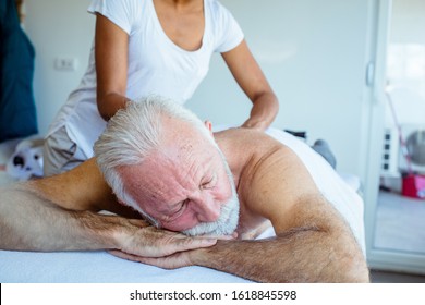 Getting royal treatment. Senior man on massage.