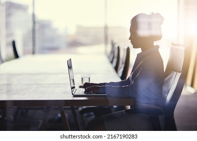 Getting Straight Down To Business. Cropped Shot Of A Businesswoman Working On Her Laptop In The Office.