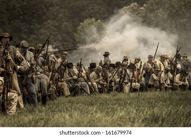GETTYSBURG, PA USA, July 4, 2013 Confederate skirmish line during the 150th reenactment of the Battle of Gettysburg. Color is intentionally desaturated to give it more of a old photo look.