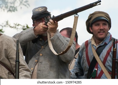 GETTYSBURG, PENNSYLVANIA- JULY 6: Confederate reenactors battle during the second day of the Reenactment of the 150th Anniversary of the Battle of Gettysburg in 2013.
