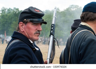 GETTYSBURG, PENNSYLVANIA - JULY 6: A Union reenactor aims his Springfield rifle during the second day of the Reenactment of the 150th Anniversary of the Battle of Gettysburg in 2013. 