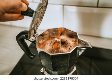 Geyser coffee maker. Silver geyser  machine is a device for the kitchen. fragrant coffee. The process of making coffee in a geyser coffee maker. selective focus.  - Powered by Shutterstock