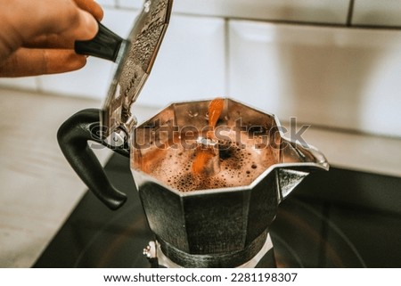 Geyser coffee maker. Silver geyser  machine is a device for the kitchen. fragrant coffee. The process of making coffee in a geyser coffee maker. selective focus. 