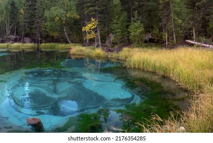 Geyser lake with turquoise water in Altai mountains, Siberia, Russia.