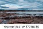 Geysir area. Steam vents, fumaroles and boiling mud pots. Panorama of suggestive volcanic landscape in the Golden Circle, Iceland. Geothermal area in Haukadalur.