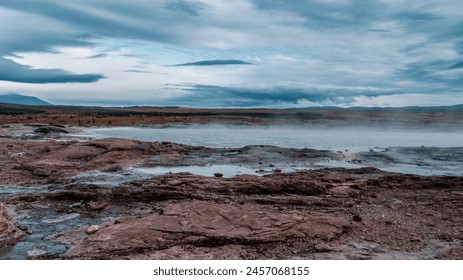 Geysir area. Steam vents, fumaroles and boiling mud pots. Panorama of suggestive volcanic landscape in the Golden Circle, Iceland. Geothermal area in Haukadalur. - Powered by Shutterstock