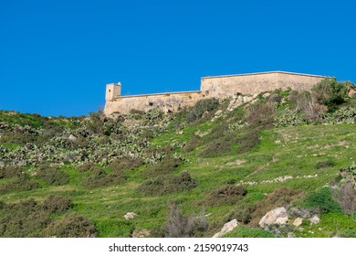 GHAJNSIELEM GOZO, MALTA - Dec 13, 2021: The historic Fort Chambray, in Gozo, Malta, a fortress built by the Order of St John to protect the coastline and sea at Xatt l-Ahmar, Ghajnsielem