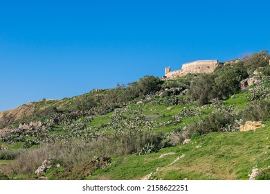 GHAJNSIELEM GOZO, MALTA - Jan 02, 2022: Panoramic view of hills and Fort Chambray, in Gozo, Malta, fortress built by Order of St John to protect the coastline at Xatt l-Ahmar, Ghajnsielem
