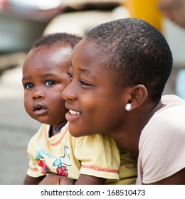 GHANA - MARCH 2, 2012: Portrait Of An Unidentified Ghanaian Mother And Her Child In Ghana, On March 2nd, 2012. People In Ghana Suffer From Poverty Due To The Slow Development Of The Country