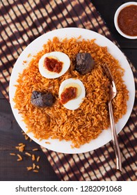 Ghana Rice Jollof Dish With Shito Sauce, Beef And Boiled Egg