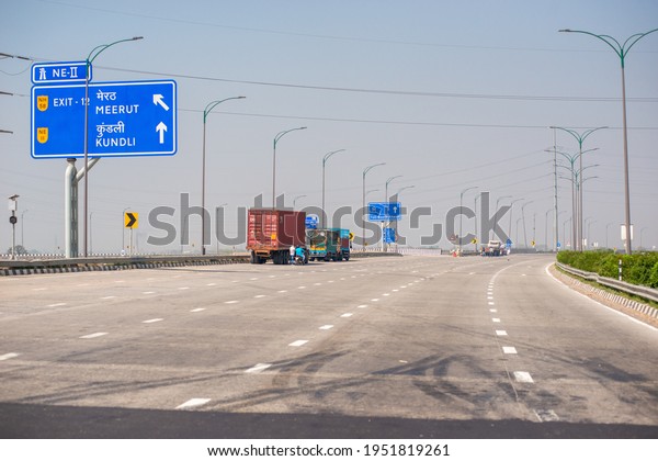 Ghaziabad, Uttar Pradesh,\
India- 6 March 2021: trucks parked on roadside,  eastern peripheral\
way, largest Ring Road around Delhi,  to save delhi from air\
pollution.