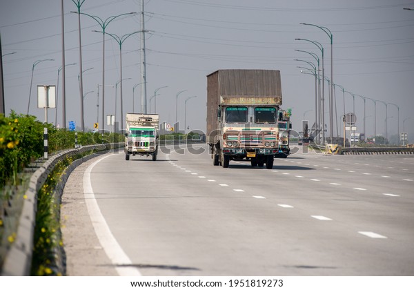Ghaziabad, Uttar Pradesh, India- 6 March\
2021: cars and trucks on eastern peripheral way, largest Ring Road\
around Delhi,  to save delhi from air\
pollution.