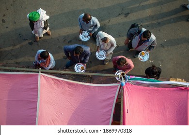 Ghaziabad, Uttar Pradesh, India- December 8 2020: Farmer's Eating Langar(community Kitchen)food During Farmer's Protest. 