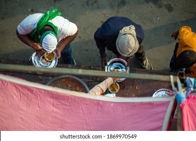 Ghaziabad, Uttar Pradesh, India- December 8 2020:  Farmer's Eating Langar(community Kitchen)food During Farmer's Protest. 