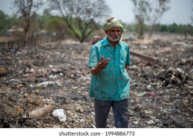 Ghaziabad, Uttar Pradesh, India- June 1 2019: Poor Man In Head Clothe And Wearing Dirty Clothes, His Earning Source Of Money Is Collecting Garbage From Landfill Site In Ghaziabad, Uttar Pradesh,