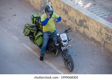 Ghaziabad, Uttar Pradesh, India-April 4 2021: A BigBasket Delivery Boy With Food Order,  Amid Covid  Lockdown In India, Emergency Services During Pandemic.