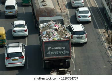 Ghaziabad, Uttar Pradesh/India- October 08  2020: Garbage Truck Stuck In City Traffic Jam 