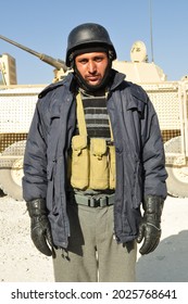 GHAZNI, AFGHANISTAN - November 2010: An Afghan National Police Officer Poses For A Photo Before Going On A Mission To Find Taliban Fighters In Eastern Afghanistan.