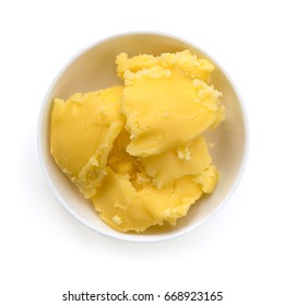 Ghee in dish, top view, isolated on white.  Clarified butter.