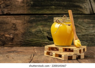 ghee oil. Ghee or clarified butter in jar on a wooden background. banner, menu, recipe place for text. - Shutterstock ID 2200145467