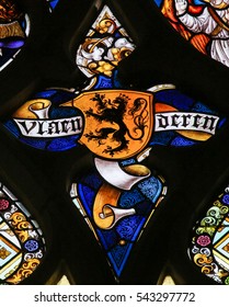 GHENT, BELGIUM - DECEMBER 23, 2016: Stained Glass window depicting the Flemish Lion and the text Vlaanderen (Flanders) in the Cathedral of Saint Bavo in Ghent, Flanders, Belgium.