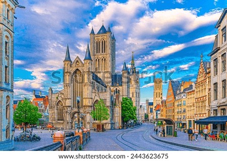 Ghent city historical center with Saint Nicholas Church on Korenmarkt Wheat Market square, Belfry Het Belfort van Gent and row of colorful buildings, East Flanders province, Flemish Region, Belgium