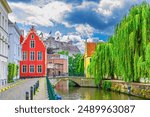 Ghent cityscape, embankment promenade of Lieve water canal, old brick buildings, Ghent historical city centre Prinsenhof Princes Court, Castle of the Counts in Gent old town, Flemish Region, Belgium