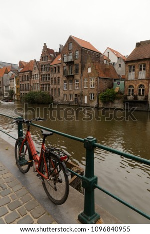 Ghent,Belgium: medieval architecture, on the riverfront and bicycle 