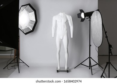 Ghost Mannequin And Professional Lighting Equipment In Modern Photo Studio