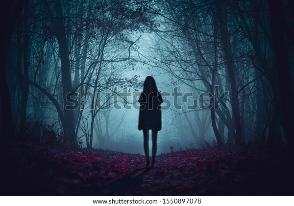 Ghost\
on the scary road in the paranormal world. Horrible dream. Strange\
forest in a fog. Mystical atmosphere. Dark wood. Mysterious road.\
Gothic witch. Background wallpaper. Gloomy times.\

