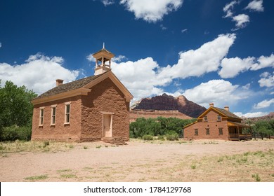 A Ghost Town School Building And Large House Restored To Original Condition In A Ghost Town In Southern Utah.