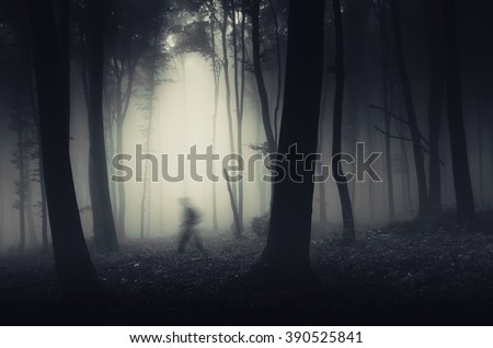 ghostly figure in dark spooky forest halloween scene