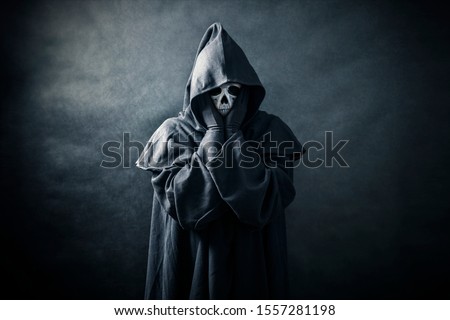 Ghostly figure in hooded cloak