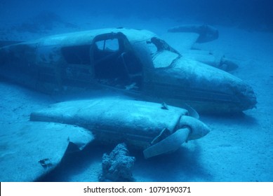 Ghostly plane wreck on sea bottom with doors and windows gone, New Providence Island, Bahamas.