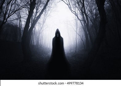 ghostly silhouette in spooky dark forest
