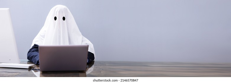 Ghostwriter Writing Article On Laptop In Office