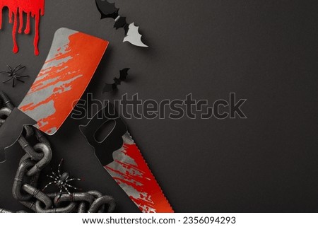 Ghoulish Halloween Array: From top view, assemblage of Halloween-themed items - chains, blood trails, maniac tools, cleaver, saw, spiders, bats, encircling a vacant space for text on black backdrop