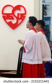 Gia Dinh Church. Catholic mass. Two altar boys.  Ho Chi Minh City. Vietnam.  04-30-2018