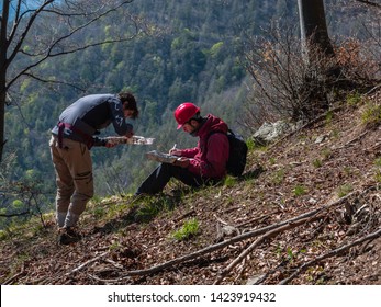 Giaglione, Susa Valley, Piedmont, Italy - April 17, 2014: Researchers of the University of Turin carry out research in a forest after the fire.