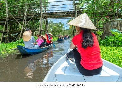 An Giang, Vietnam - September 3rd, 2022: Traveler Beautiful Woman On A Boat Tour Along The Canals In The Mangrove Forest. This Is An Eco Tourism Area At Mekong Delta In An Giang, Vietnam